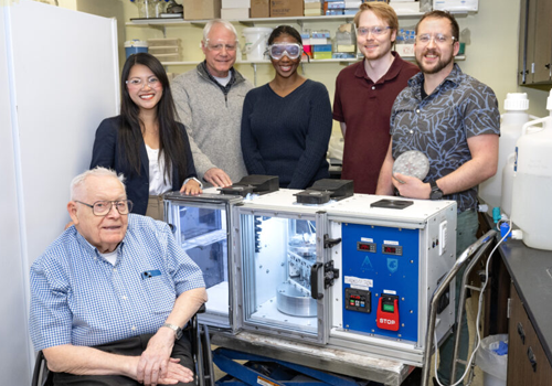 Team of six people working on immunotherapy tool.